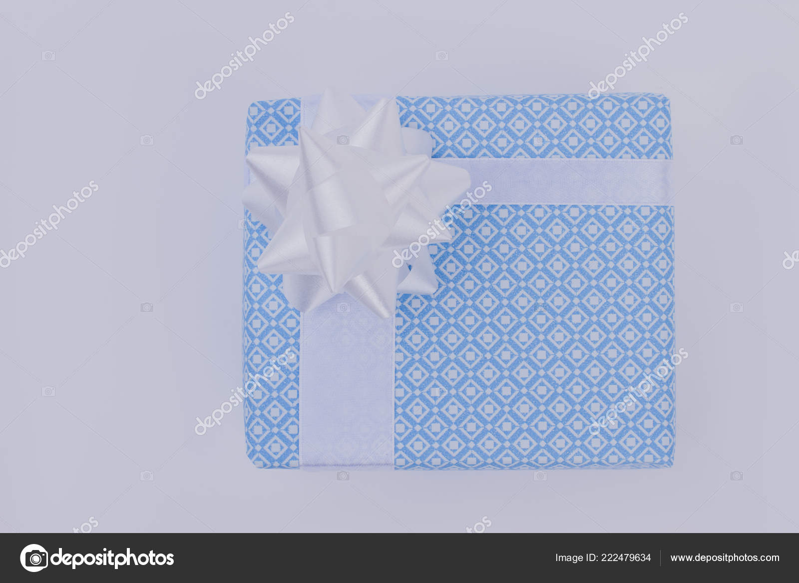 Light blue gift box with white bow. Stock Photo by ©Denisfilm 222479634