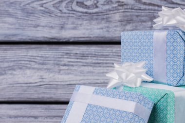 Gift boxes on wooden background. clipart