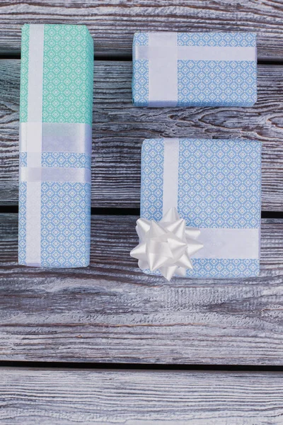 Festive gift boxes on wooden background. — Stock Photo, Image