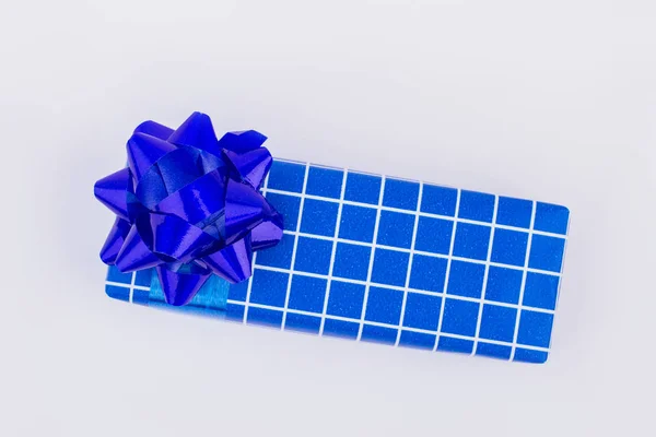 Blue gift box with white plaids. — Stock Photo, Image
