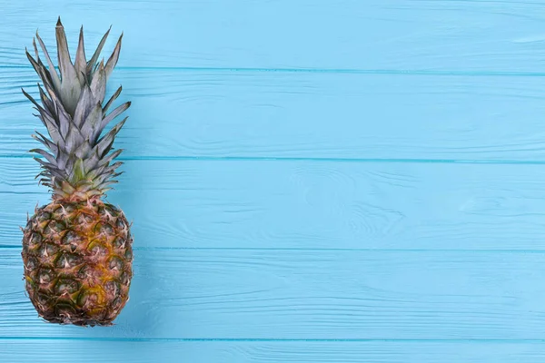 Pineapple with green leaves and copy space. — Stock Photo, Image