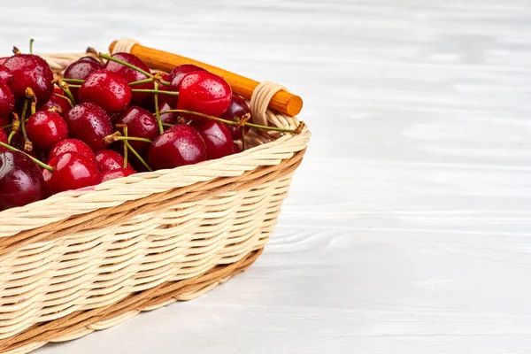 Sweet cherries in basket and copy space.