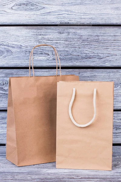 Blank kraft paper shopping bags.