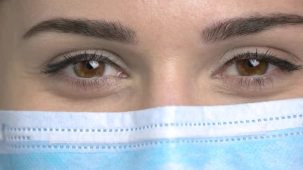 Macro view, female doctor eyes closing. — Stock Video