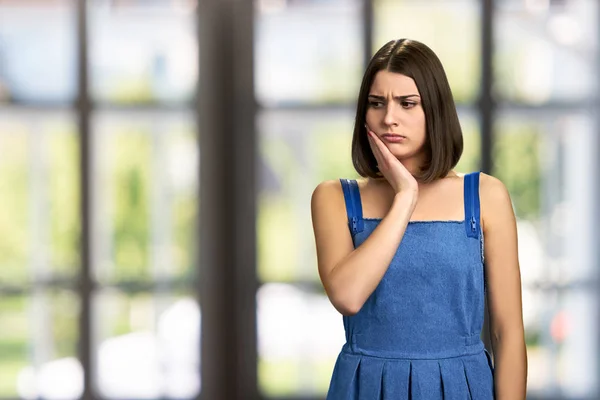 Young brunette having sudden tooth pain. — Stock Photo, Image