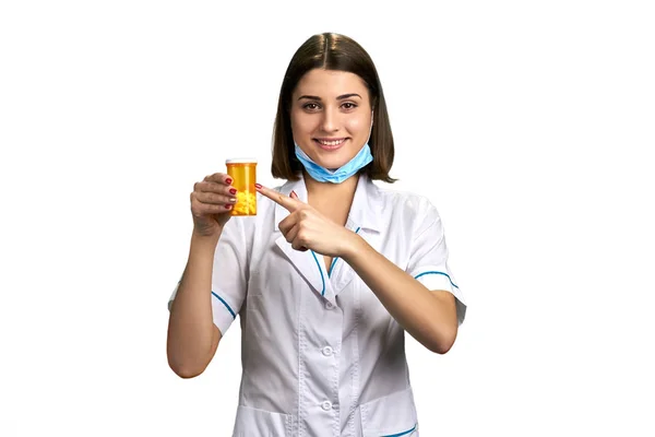 Young physician pointing on medication. — Stock Photo, Image