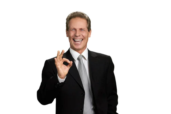 Happy mature businessman showing ok sign. — Stock Photo, Image