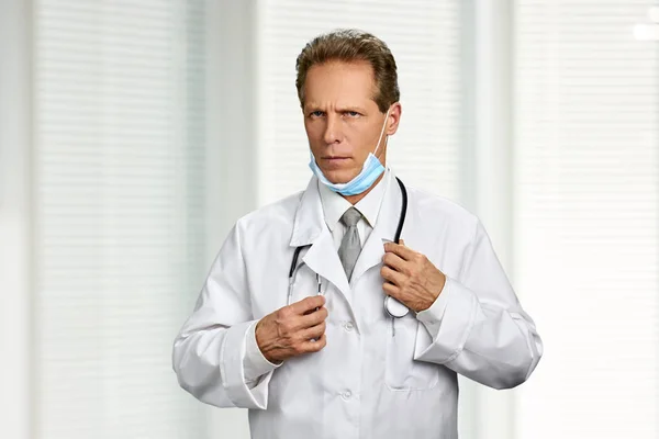 Portrait of confused doctor with stethoscope.