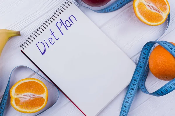 Diet plan inscription on paper notebook.