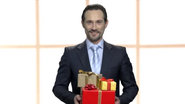 Man giving stack of gift boxes. — Stock Video