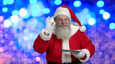 Eski moda Santa gösteren dijital tablet.
