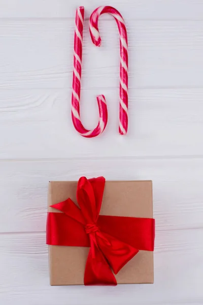Candy cane and handmade gift box.