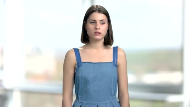 Good-looking female student looking astonished. — Stock Video