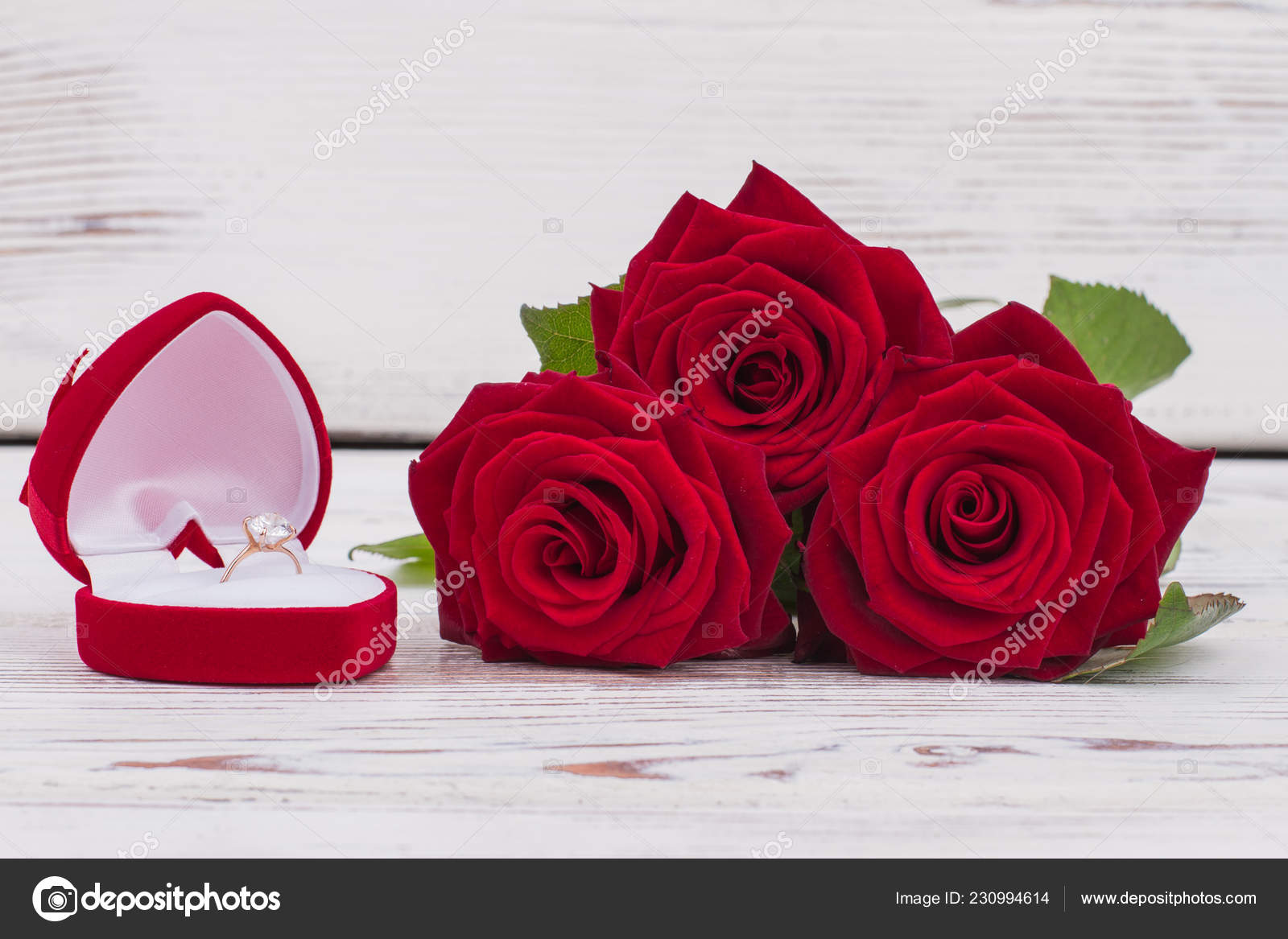 Red roses and engagement — Stock Photo © Denisfilm #230994614