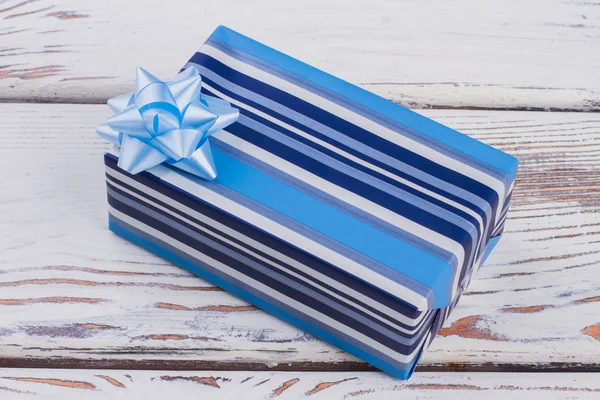 Blue striped gift box with bow. — Stock Photo, Image