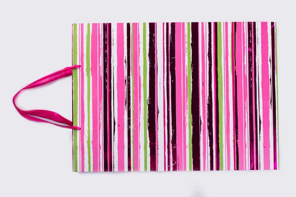 Shopping bag with pink stripes. — Stock Photo, Image