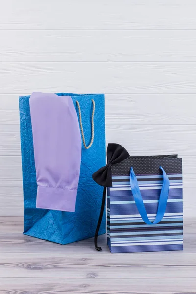 Shopping bags with male purchases. — Stock Photo, Image