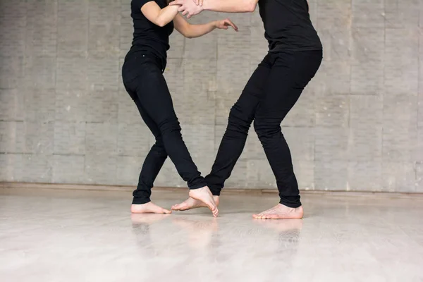 Young couple performing modern dance.