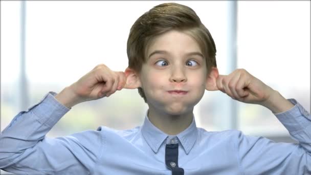 Cute kid boy fooling around. — Stock Video