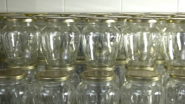 Empty glass jars for food storage.