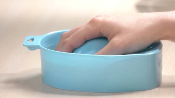 Hand and bowl of water, slow motion. — Stock Video