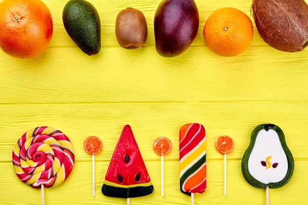 Various tropical fruits and candies. — Stock Photo, Image