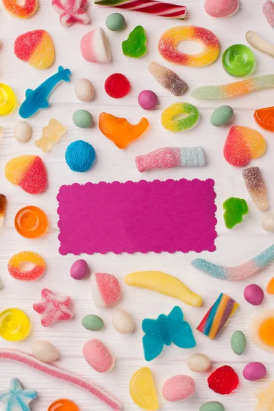 Tasty colorful candies on wooden background. — Stock Photo, Image