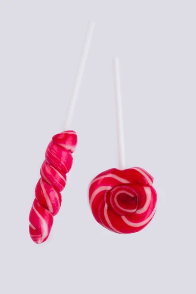 Swirl red lollipops on white background. — Stock Photo, Image