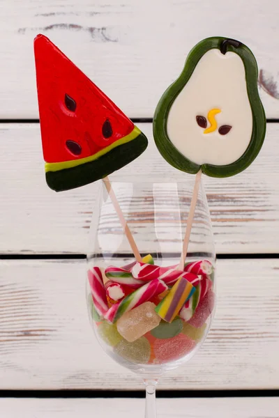 Decoration with lollipops in wine glass.