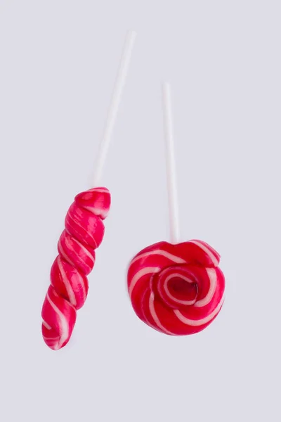 Swirl red lollipops on white background. Royalty Free Stock Photos