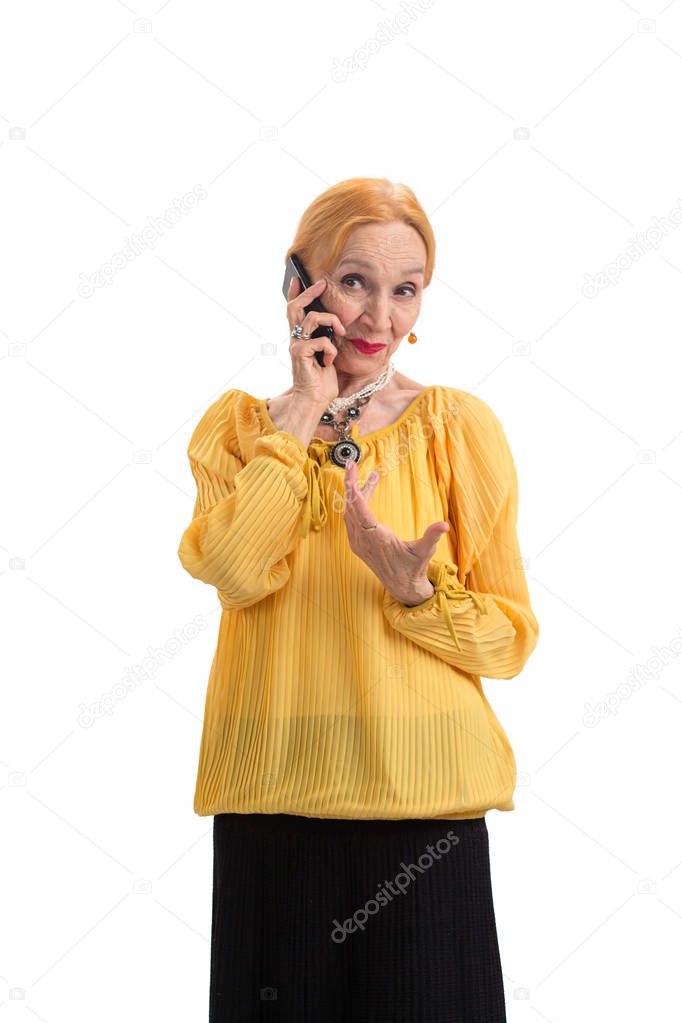 Elderly lady holding cell phone.