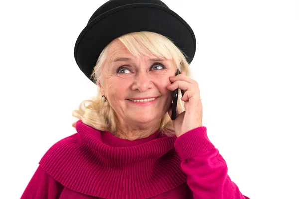 Smiling senior lady holding cellphone. — Stock Photo, Image