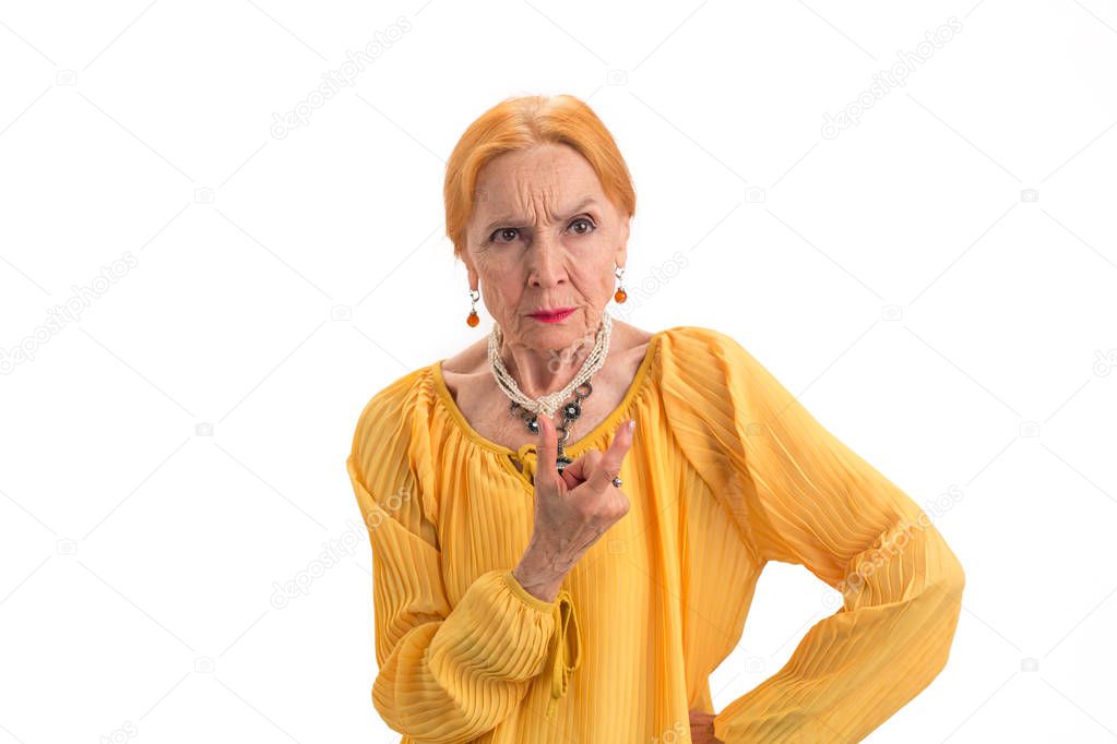 Angry senior woman isolated.