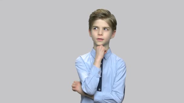 Cute boy with thoughtful expression. — Stock Video