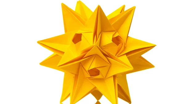 Yellow origami transforming spiky ball. — Stock Photo, Image
