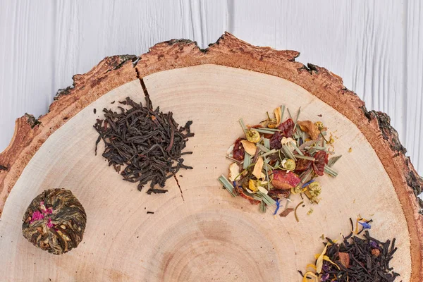 Close up wood slice and dry tea set.