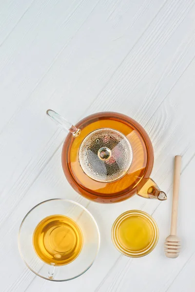 Teapot, honey and cup of tea. — Stock Photo, Image