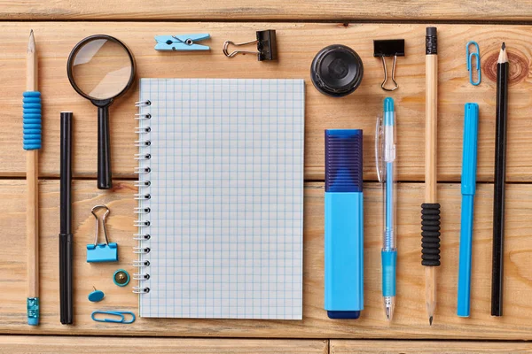 School supplies on wooden background, top view. — Stock Photo, Image