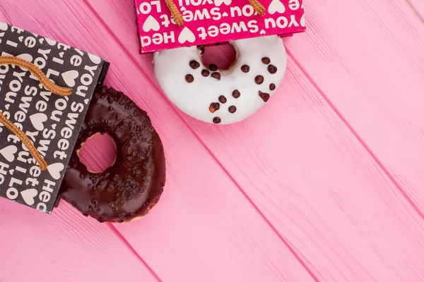 Donuts on wooden background and copy space. — Stock Photo, Image