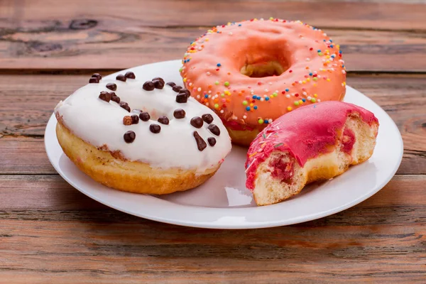 Donuts on white plate. — Stock Photo, Image