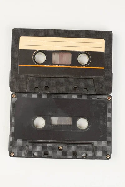 Two black audio tapes. — Stock Photo, Image