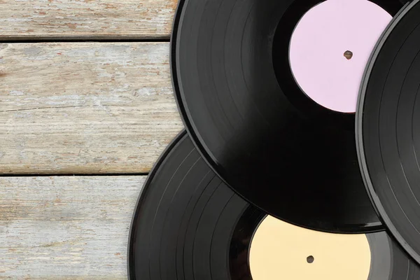 Vinyl records on wooden background. — Stock Photo, Image