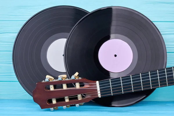 Vinyl records and guitar head. — Stock Photo, Image