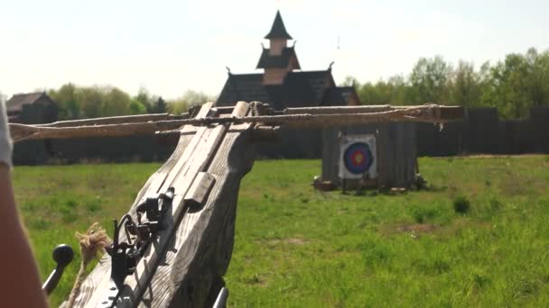 Close up man shooting with an old vintage crossbow. — Stock Video