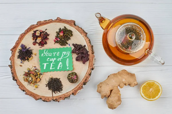 Teapot, lemon, ginger and dry tea assortment. — Stock Photo, Image