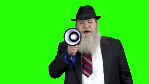 Old bearded man making announcement in megaphone. — Stock Video