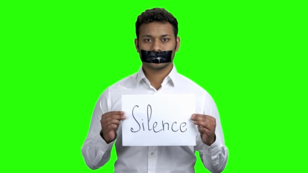 Censored man holding card with inscription Silence. — Stock Video