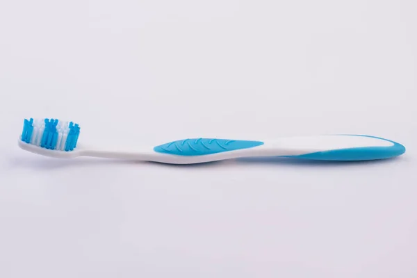 Plastic tooth brush on white background. — Stock Photo, Image
