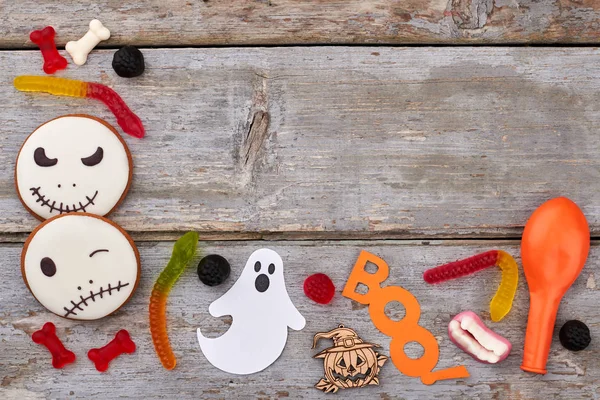 Halloween accessories on wooden background.