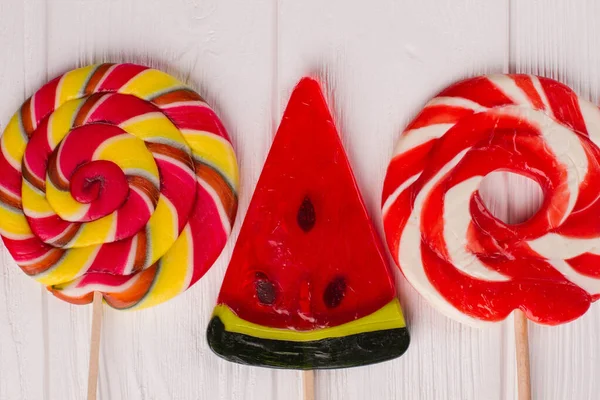 Close up large colorful lollipops on white background. — Stock Photo, Image